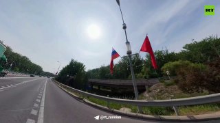 Пекин украсили флагами России и Китая к визиту Путина
